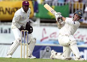 Australia�s Justin Langer of Australia hits a six off Omari Banks