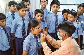Students being examined at a two-day dental camp