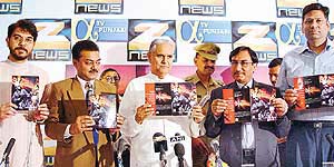 Haryana Governor Babu Parmanand (centre) releases the brochure of �Mission Akshardham�, a Zee TV�s telefilm, at a function organised at Hotel Mountview in Chandigarh on Wednesday.