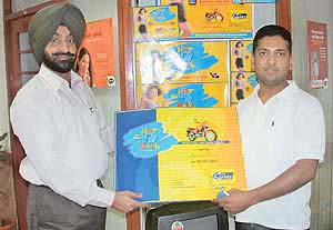Mr Y.S. Bains, vice-president, Spice Telecom, hands over the first prize to Mr Jatinder Arora on Wednesday in Chandigarh .