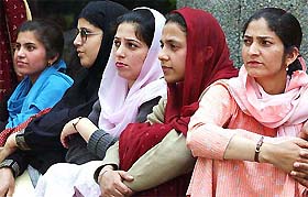 Employees of General Post Office in Srinagar sit in dharna