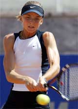 Daniela Hantuchova of Slovakia hits a backhand return to Magui Serna of Spain 