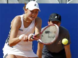 Nadia Petrova of Russia hits a backhand return to Monica Seles of the US