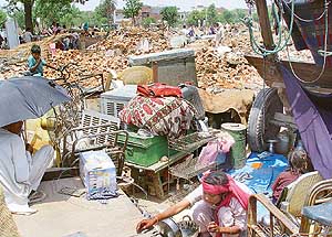 Illegally built pucca houses and jhuggis near Sector 38 West, Chandigarh, were demolished in a major drive against encroachments on Thursday.