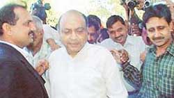 The supended Jalandhar District and Sessions Judge, Mr R.M. Gupta, coming out of the UT District Courts after being remanded in police custody by the UT CJM in Chandigarh on Friday. 