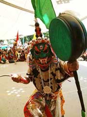 A man performs traditional folk dance during the Budh Purnima celebrations