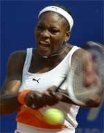 Serena Williams of the US hits a backhand return to Conchita Martinez of Spain