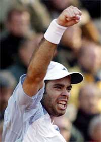 Fernando Gonzales of Chile celebrates his victory over Lleyton Hewitt of Australia 