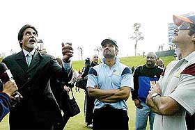 Amitabh Bachchan tosses the coin to kick off a charity cricket match in Pretoria