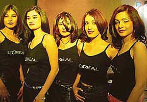 Models display a range of hairstyles at Tress Lounge, a L�Oreal collaboration beauty salon, that was inaugurated in Sector 8-C