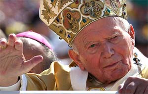 Pope John Paul II waves as he arrives to celebrate a solemn Mass in St. Peter's Square at the Vatican 
