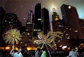 A dragon made of incense sticks is being paraded through a Hong Kong street on Sunday, in the hopes that it will drive away SARS