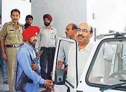 The IG (Intelligence), Punjab, Mr Shashi Kant, whose gunmen assaulted a contractor of a parking lot, comes out of the Sector 17 police station on Monday. 