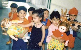 Kids of Lovely Lotus Nursery School show their toys to their parents as they celebrate Parents