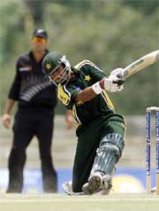 Pakistani all-rounder Shoaib Malik hits a six 