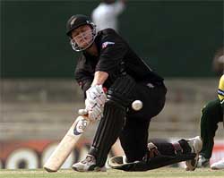 New Zealand batsman Scott Styris sweeps the ball for a four