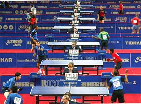 Players take part in the preliminary round of the World Table Tennis championship