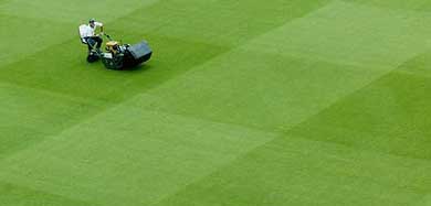 A member of the ground staff prepares the Lord's cricket ground on Wednesday for the first Test between England and Zimbabwe