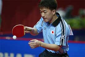 Toshio Tasaki of Japan hits a forehand return against Chetan Babboor of India