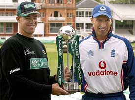 Zimbabwe cricket captain Heath Streak and his English counterpart Nasser Hussain hold the Test trophy 