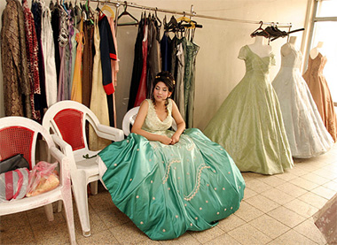 An Iraqi bride-to-be tries on a wedding dress