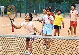 Budding trainees at a practice session at the Sector 10 tennis stadium