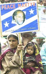 Kashmiri woman supporter of the People's Conference with her child