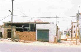 A part of the common passage has been blocked by the building coming up on government land on the Dugri Road