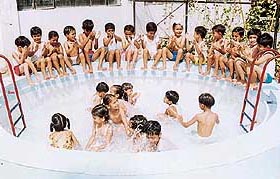 Tiny tots of Bal Niketan Model Senior Secondary School, Sector 37-A, Chandigarh, take a splash in a pool on Friday.