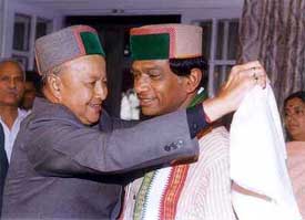 Himachal Pradesh Chief Minister Virbhadra Singh  offers a shawl to Chattisgarh Chief Minster 