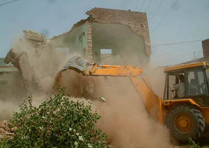 The dwellings allegedly encroached upon government land being demolished 
