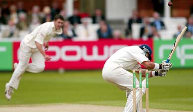 England's Alec Stewart ducks below a bouncer delivered by Zimbabwe's Travis Friend