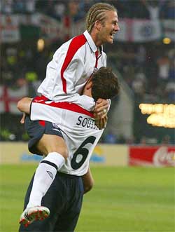 England's Gareth Southgate celebrates with David Beckham
