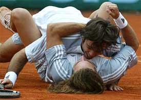 Chile�s tennis players Fernando Gonzalez, bottom, and Nicolas Massu jubilate after they won the Tennis World Team Championships 2003 in Dusseldorf