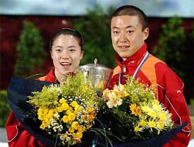 Republic of China players Nan Wang and Lin Ma pose with the trophy after winning the final of the Table Tennis World Championships