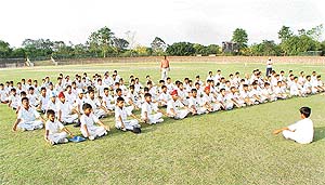 Budding cricketers meditate at the Sector 16 Cricket Stadium in Chandigarh