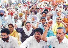 Members of the Punjab state council of the (CPI) stage a dharna against the alleged anti-people policies of the Punjab Government at the Matka chowk in Chandigarh