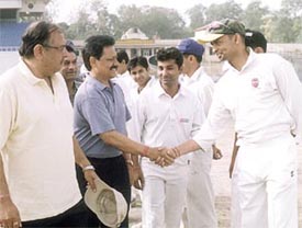 DDCA sports secretary Sunil Dev and former Test opener Chetan Chauhan meeting the players 
