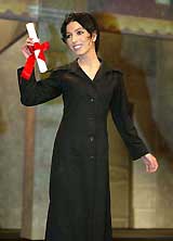 Iranian director Samira Makhmalbaf reacts after being awarded the jury award for her film, "At Five In The Afternoon,"