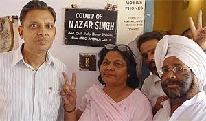 Ms Ajay Walia flanked by supporters at an Ambala court 