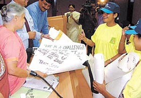 SOS children share their experience at the NIS camp with Chief Minister Sheila Dikshit at her office in the Capital on Tuesday.
