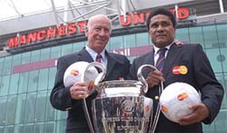 Former Manchester United player Sir Bobby Charlton and former Portugal international Eusebio, who played for Benfica of Portugal, hold the European Cup 