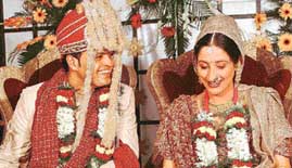 Chandigarh-based international cricket star Dinesh Mongia and his wife Aarti are all smiles at their wedding ceremony