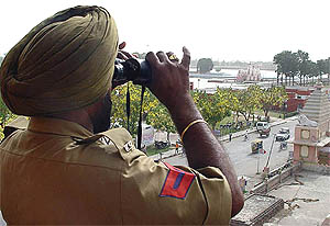 A policeman keeps vigil at Brahm Sarovar