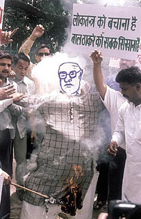 Activists of Nav Yuvak Rajput Sangathan burning the effigy of Bal Thackeray protesting against the appearance of outside candidates in Railway Board exams being held in Maharashtra at Jantar Mantar in the Capital on Wednesday