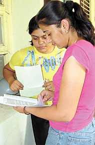 A girl perusing an admission form