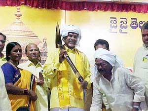 Andhra Pradesh Chief Minister N. Chandrababu Naidu carries a plough