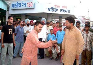 A scene from a street play, "Waapsi," being enacted at Bathinda railway station