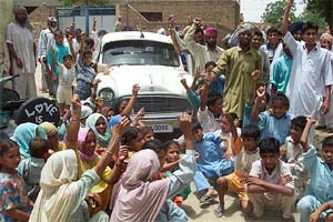 The villagers shout slogans