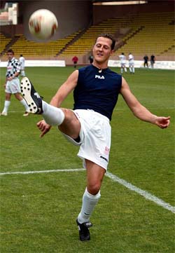 German Formula One world champion Michael Schumacher warms up before a soccer match 